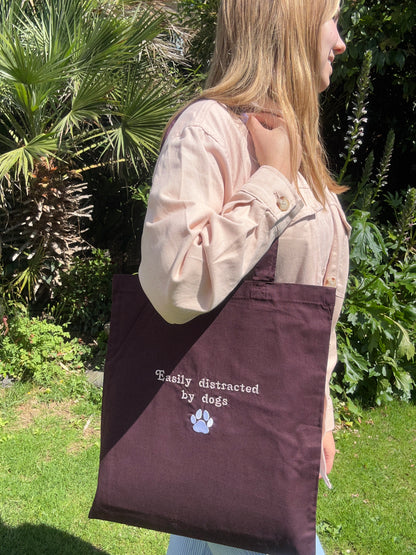 ‘Easily distracted by dogs’ tote bag