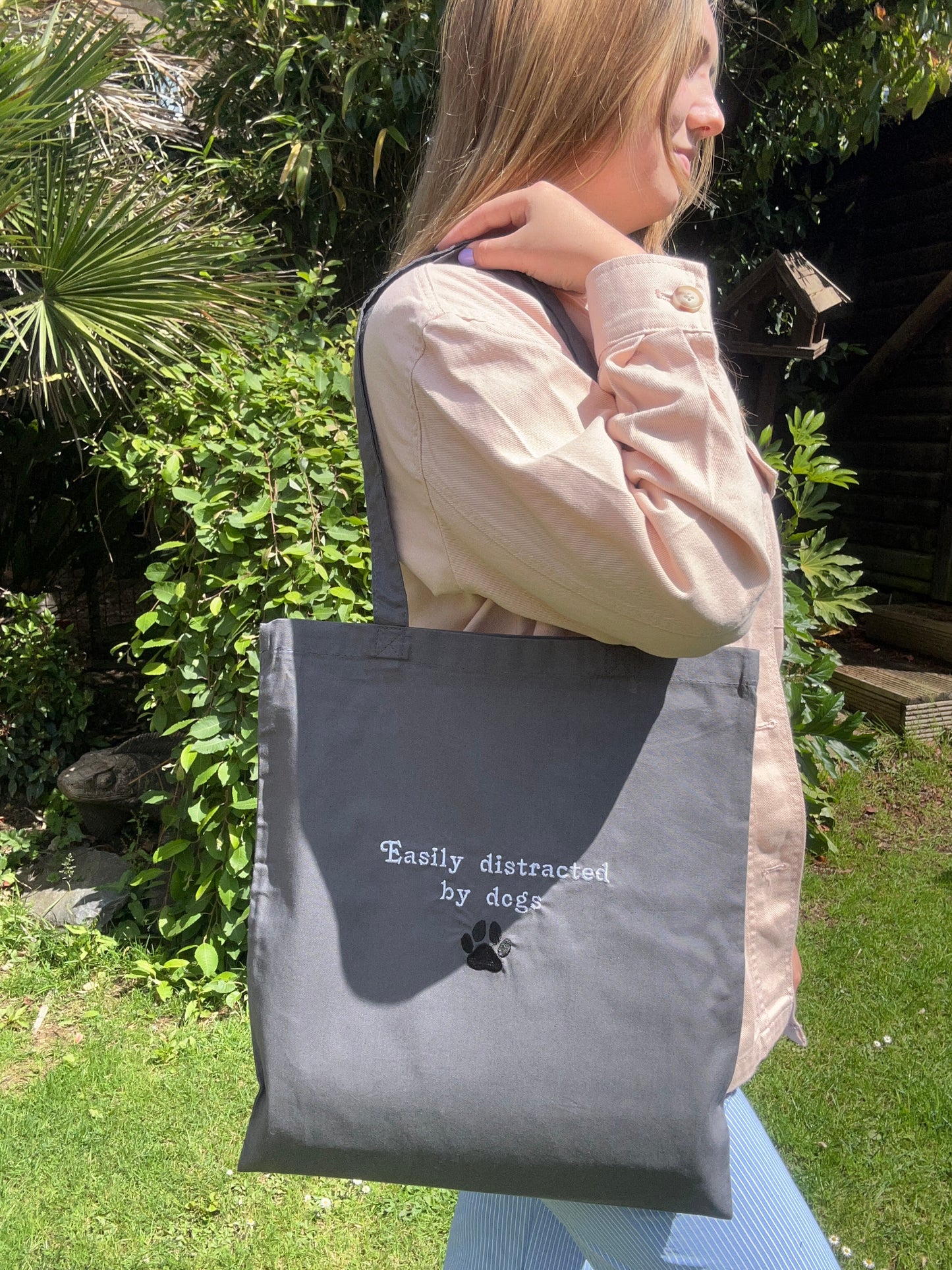‘Easily distracted by dogs’ tote bag